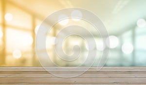 Wooden table with Blurred of interior office room with city building background photo