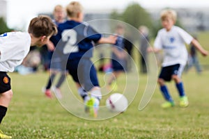 Blurred kids playing soccer