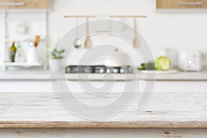 Blurred kitchen background with wooden table top for in front