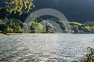 Contrast between sunlight and shadow in Furnas Lagoon, SÃ£o Miguel - Azores PORTUGAL photo