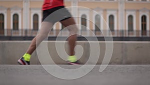 Blurred legs of city marathon runners. Slow motion video