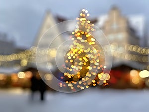 blurred light  festive Christmas tree city  shadow  with gold confetti  holiday template background greetings card copy space ban