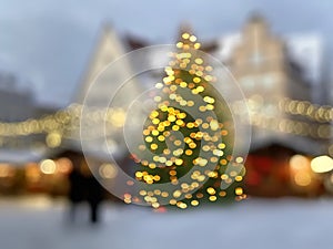 Blurred light  festive Christmas tree city  shadow  with gold confetti  holiday template background greetings card copy space ban