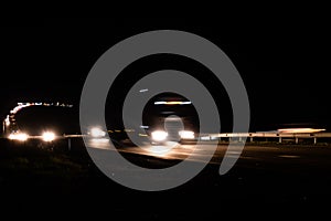 Blurred lights with car on high speed..A car driving on a motorway at high speeds, overtaking other cars
