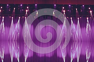 Blurred lights on stage with purple curtains