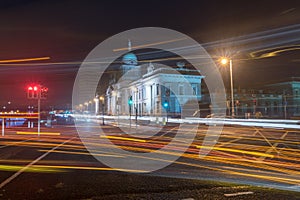 Blurred motion long exposure lines light of car headlamps headlights at night.