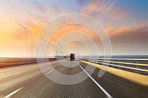 Blurred motion of truck and asphalt road