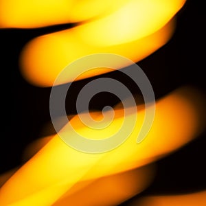 Blurred moving fire lights background, yellow, orange and white colors on black, abstract template for design, high resolution