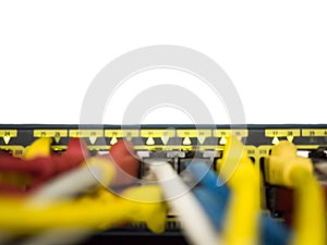 Blurred, network cables plug into switch hub