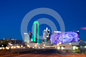 Blurred night cityscape with skyscraper and neon lights/blurred background