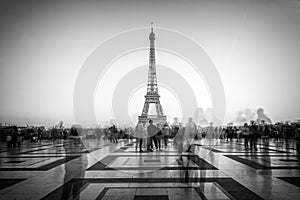 Blurred people on Trocadero square admiring the Eiffel tower, Paris France