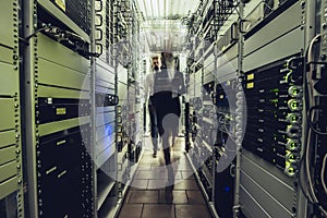 Man and woman in data centre