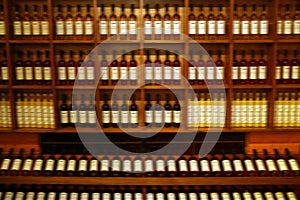 Blurred Peruvian Pisco Brandy Bottles on the Shelf, Ica region, Peru, South America