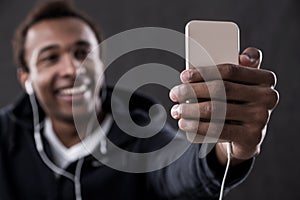 Blurred photo of African American man making selfie