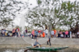 Blurred Photo, defocus or out of focus a lot of people to waiting board the boat at Hanoi, Vietnam