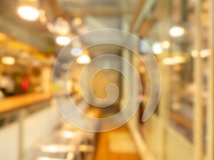 Blurred photo of interior restaurant view background with dining table set, chairs, blurry cafe, retro style.