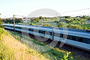 Blurred photo with passing passenger cars at high speed