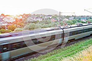 Blurred photo with passing passenger cars at high speed