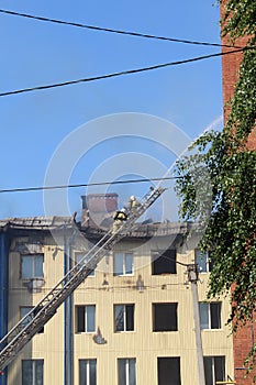 Blurred photo, two firefighters rescuers climb the stairs to the fire