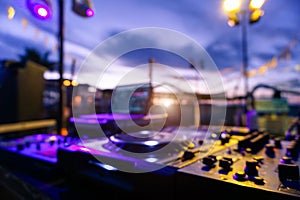 Blurred picture of Dj professional equipment for party outdoor at sunset - Defocused image - Concept of nightlife with music and