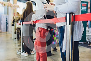 Blurred picture of Long Passenger Queue Waiting for Check-in at Airport Check-in Counters.