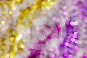 Blurred picture yellow gold and purple bokeh colorful glittering for merry christmas and happy new year festival background design