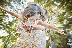 Blurred portrait of a mother playing with her daughter