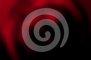 Blurred radial gradient dark red and black abstract background. Mixed circular texture