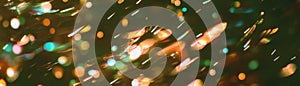 Blurred rain texture with streaks of light against a dark background for creative banners photo
