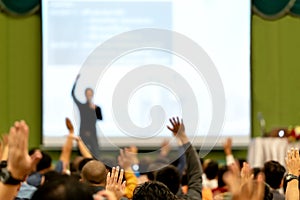 Blurred of rear view Audience in conference hall or seminar room. Speaker are brainstorming, motivational speech at photo