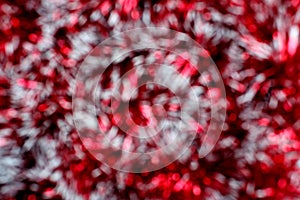 Blurred red shiny christmas tinsel texture for decoration