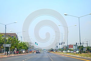 Blurred road and car background abstract of Long road way in city with car