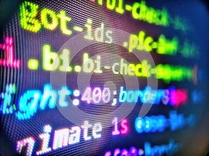 Blurred screen with selective focus. Abstract computer script code. Software development. Computing, cyberspace , future and