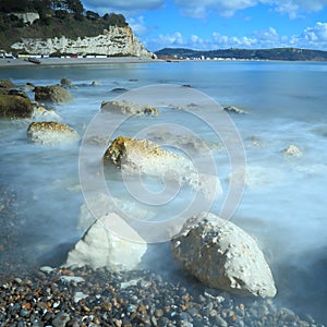 Blurred sea waves on the shingle beach