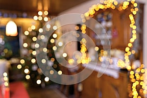 Blurred Section of Living Room Christmas Scene with Christmas Tree, Fairy Lights, Lamps and Candlelights