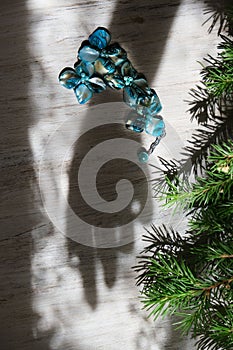Blurred shadow of female hand and branch of Christmas tree,  Abstract, play of light and shadow, shadow play illusion and holiday