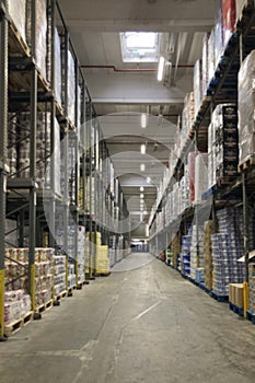 Blurred shot of warehouse with racks filled with goods