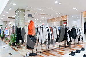 Blurred showcases fashion boutique Clothing store in a modern shopping mall. Cloth and acessorie modern shop blur photo