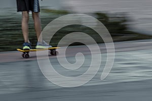 Blurred skater riding on street