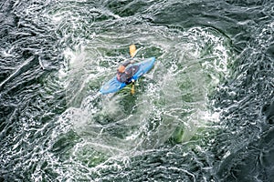 Blurred slow shutter speed shot of a canoe driver with copy space