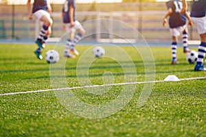 Blurred Soccer Field at School. Young Soccer Players Training on Pitch