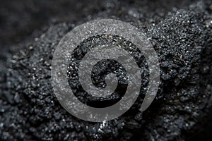 Dark background with the texture of a piece of coal