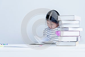 Blurred soft images of A 6 year old Asian girl Sitting reading a textbook Whit determination