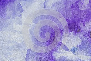 Blurred spots of purple watercolor on a paper textured background