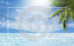 Blurred summer natural marine tropical blue background with palm leaves and sunbeams of light. White border frame. Sea and sky