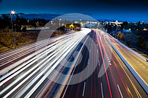 Blurred Tail Lights And Traffic Lights On Motorway