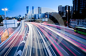 Blurred Tail Lights And Traffic Lights On Motorway