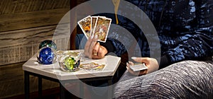 Blurred Tarot cards layout on witch table.Fortune telling and astrology,