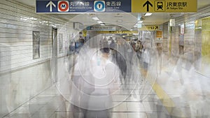 Blurred Time Lapse of Commuters at Busy Tokyo Metrorail System