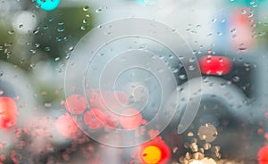 Blurred traffic lights through car windshield